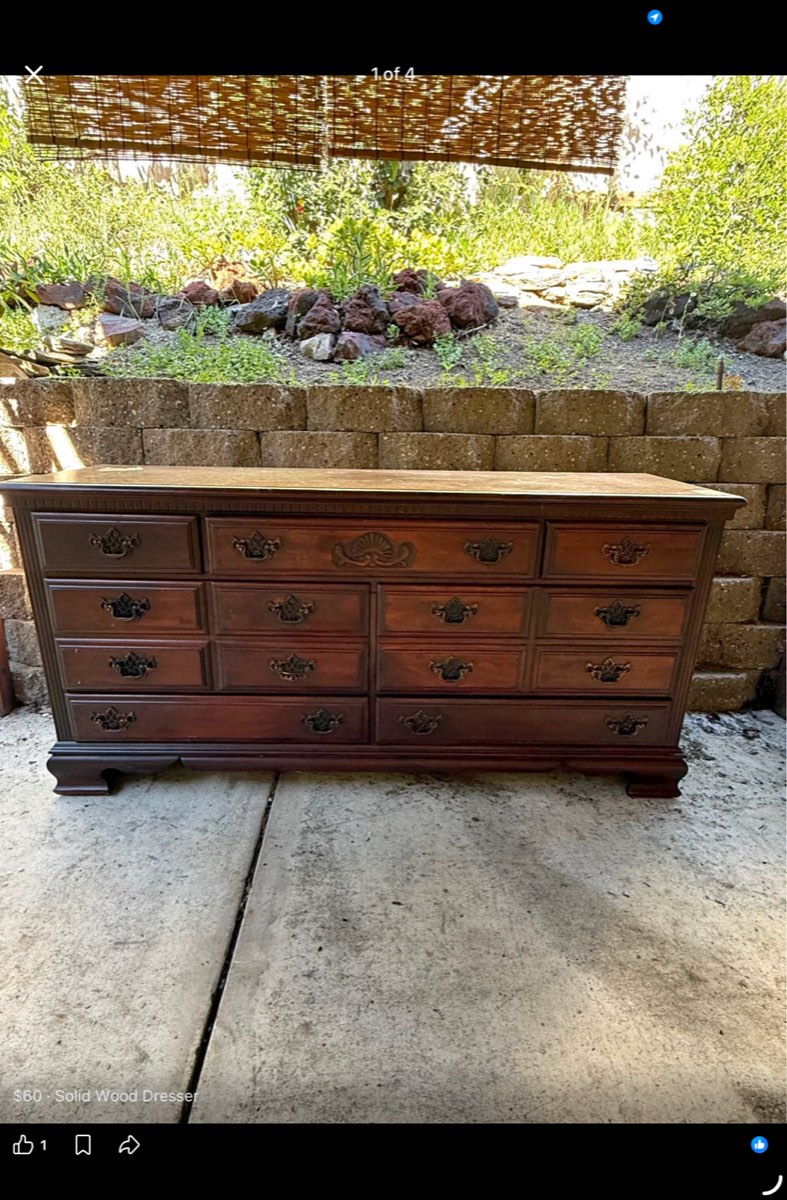 Dresser with a scalloped, ornate skirt