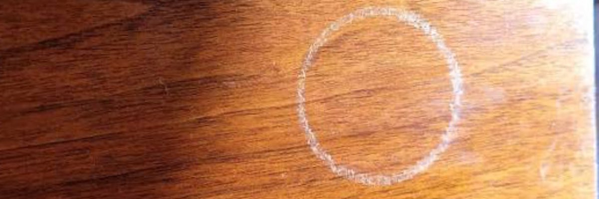 Water ring damage on a wood dresser top