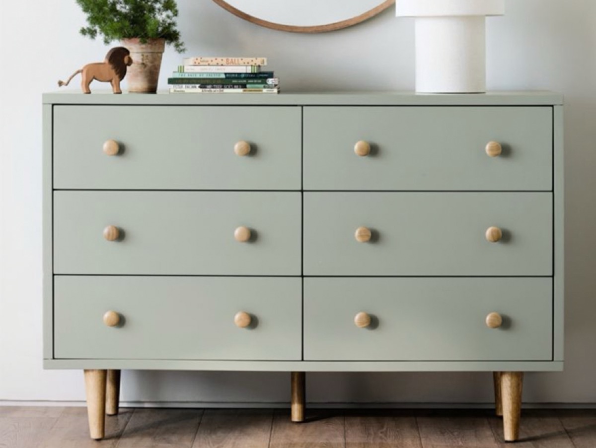 Sage green dresser refinished with wood knob hardware