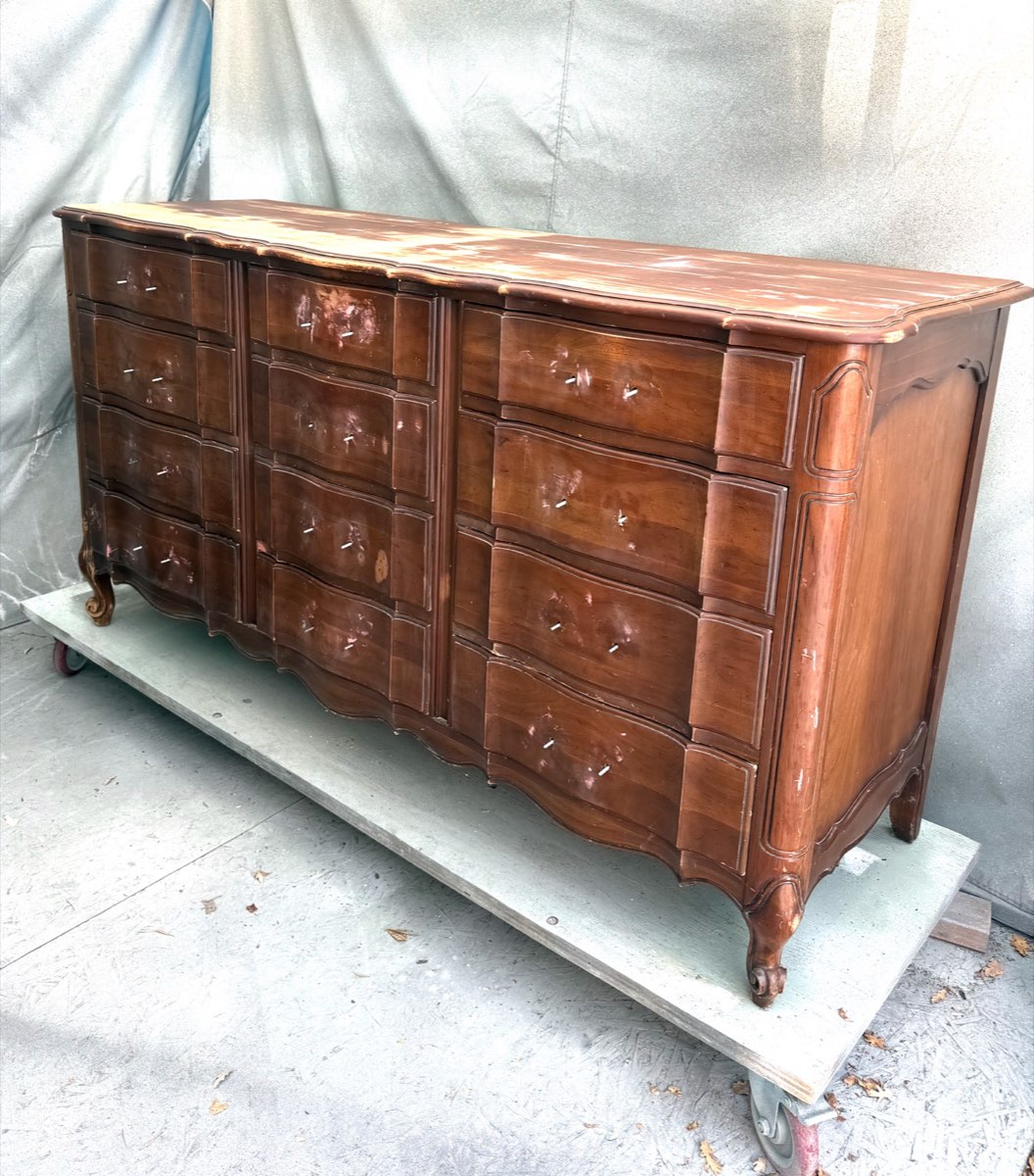 A dresser with hardware removed, sanded and prepped for the spray booth